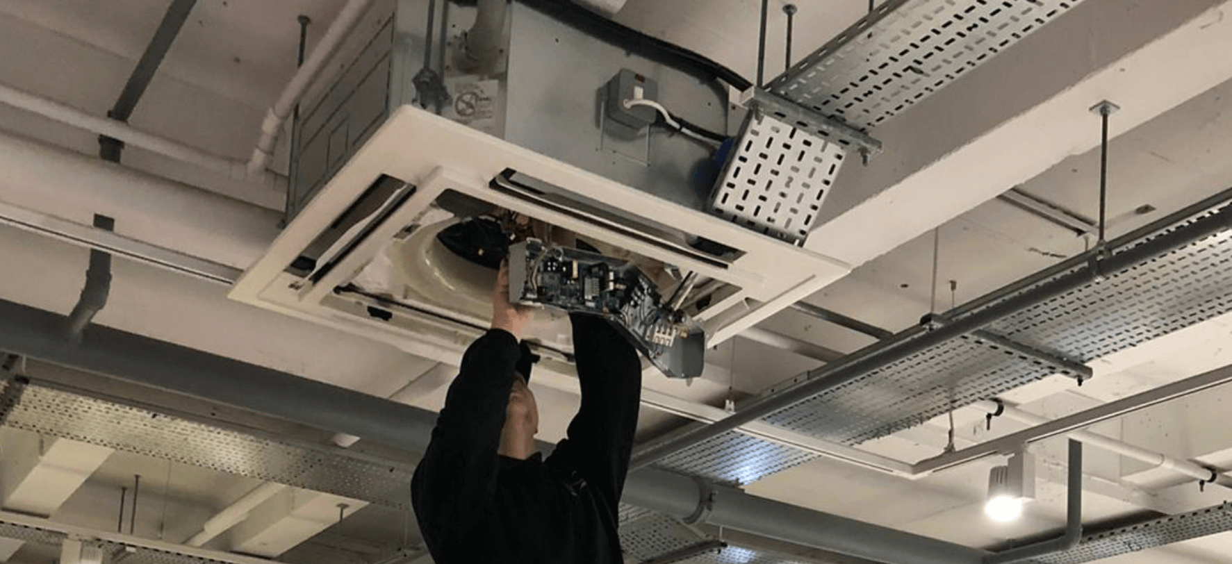 MAC Engineer working on a ceiling cassette